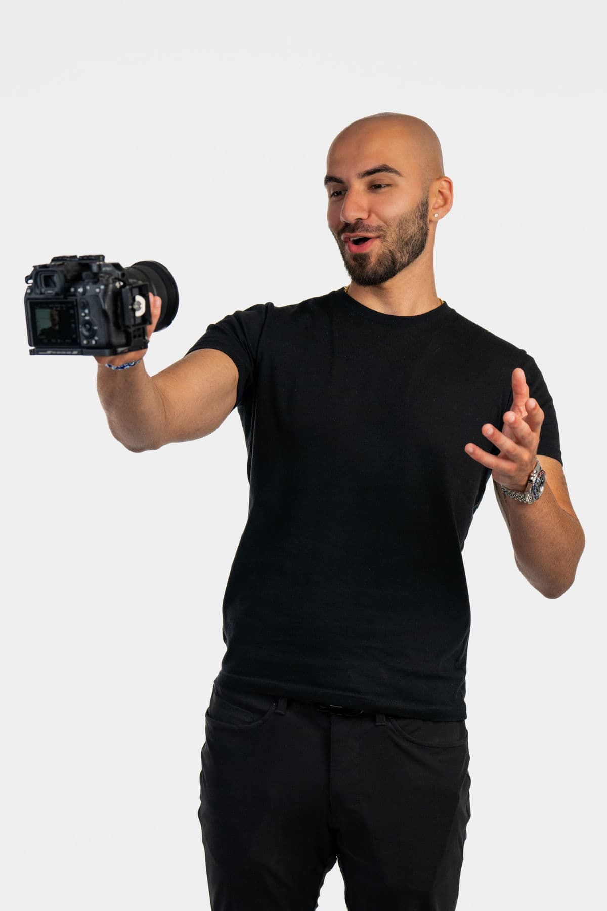 Navid Rashid with camera, creating content