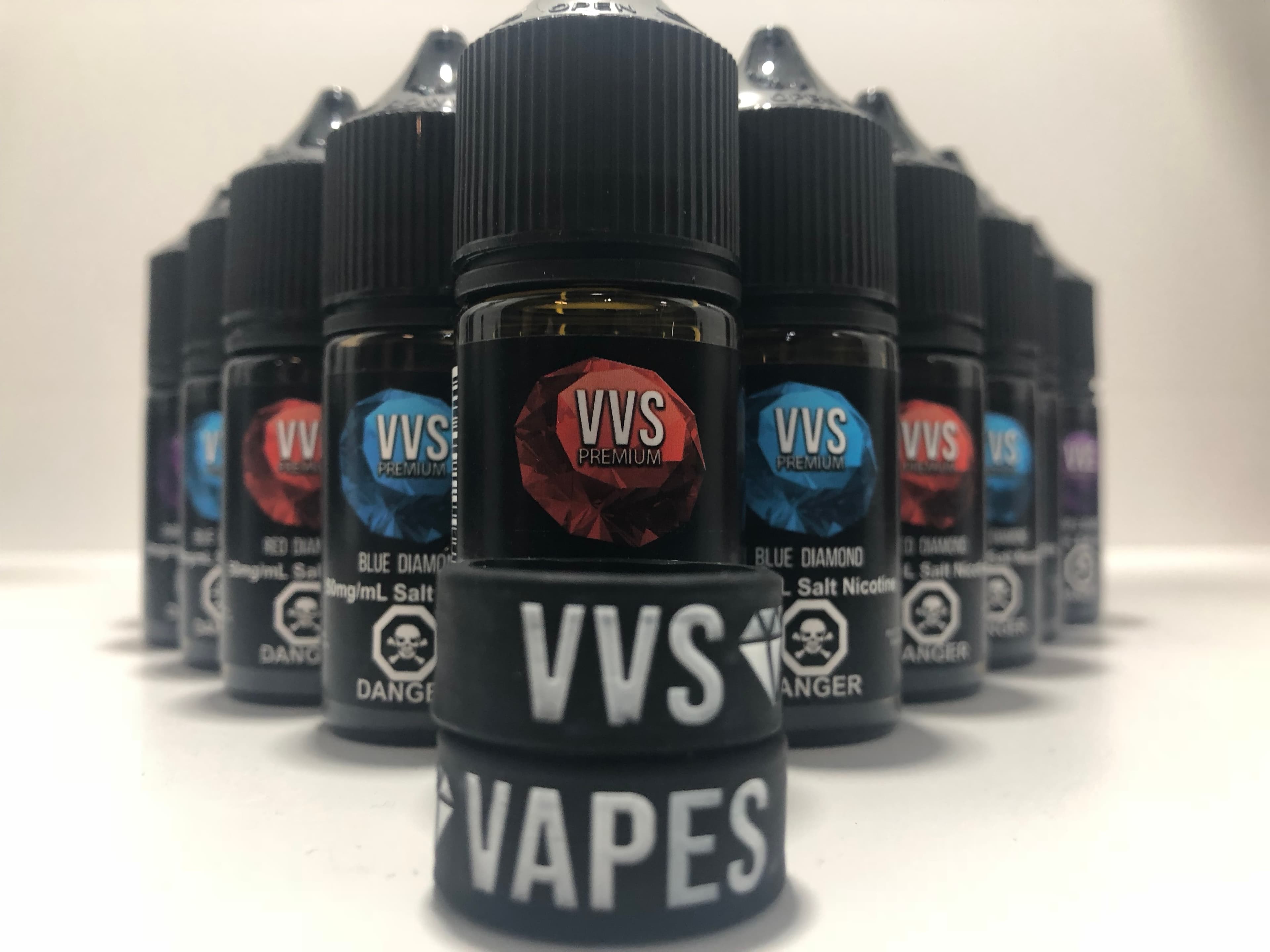 VVS Premium e-liquid lineup with branded silicone bands