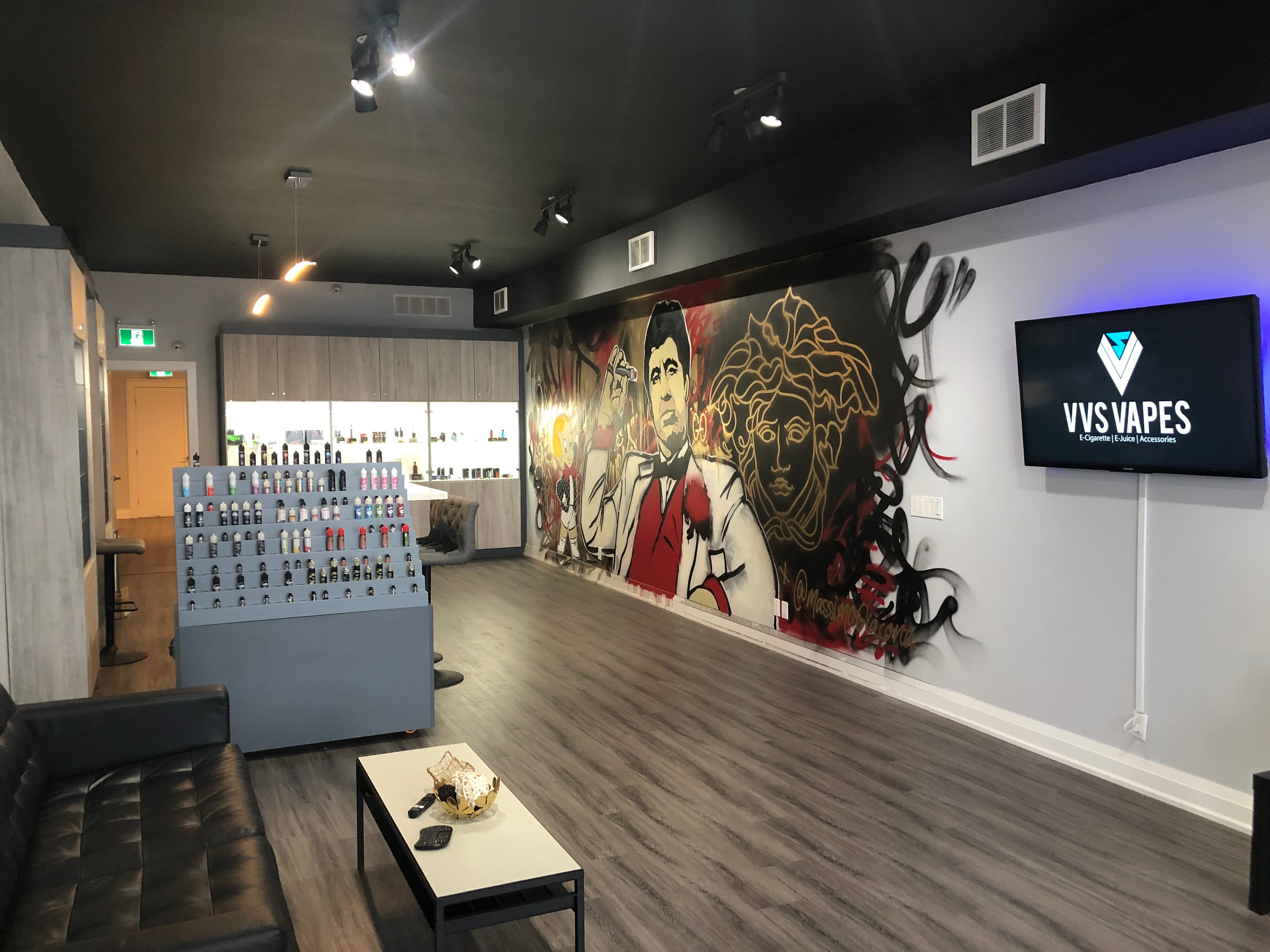 VVS Vapes lounge with mural, product wall, and seating